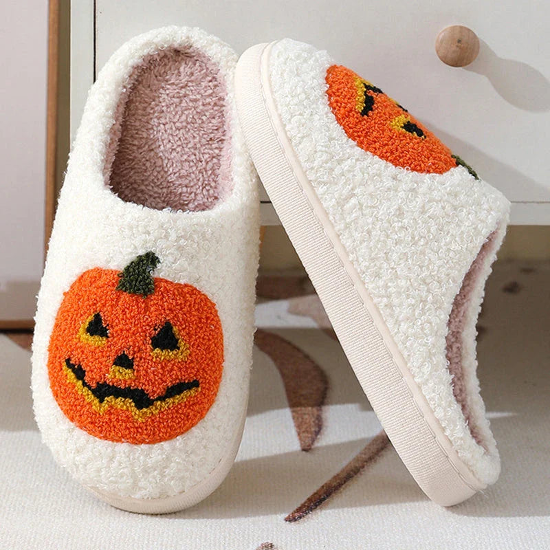 Pumpkin-shaped slippers in white and black colors, featuring a cozy cotton lining and non-slip rubber sole for comfortable indoor wear.