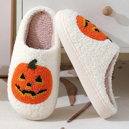 Pumpkin-shaped slippers in white and black colors, featuring a cozy cotton lining and non-slip rubber sole for comfortable indoor wear.