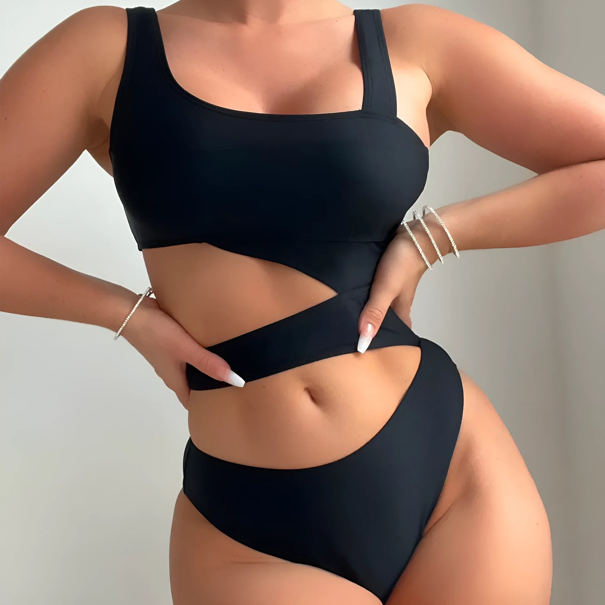 Black high-cut women's one-piece swimsuit with sleeveless design
