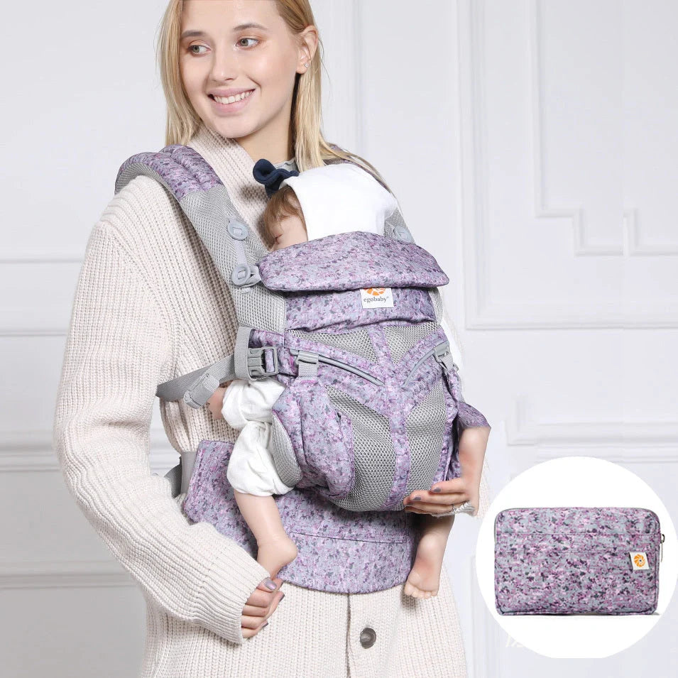 Multifunctional baby carrier in blue daisy pattern with adjustable waistband and small bag