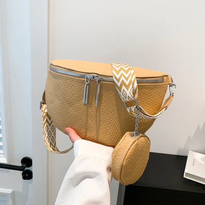 Women's solid colour PU crossbody bag with saddle lock zipper texture in clamshell design