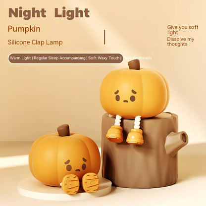 Orange silicone pumpkin night lamp measuring 98x105x83mm with built-in battery and USB charging port