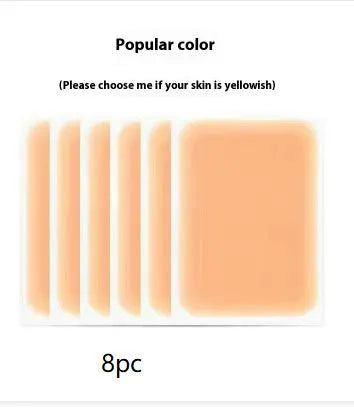 Tattoo cover patch and a 130mm long concealer brush on a table, with colour option swatches visible.