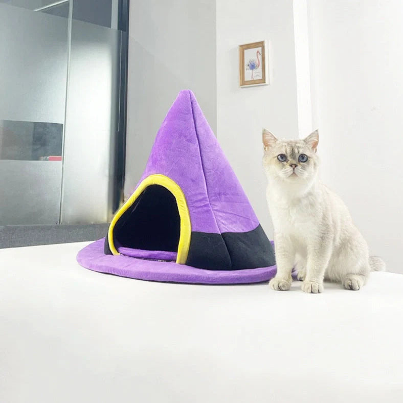 Purple witch hat shaped cat bed measuring 60cm by 45cm with cloth material