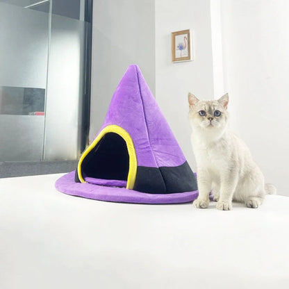 Purple witch hat shaped cat bed measuring 60cm by 45cm with cloth material
