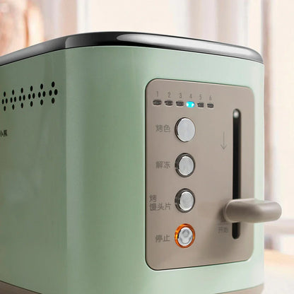 Morning mist green teddy bear toaster measuring 285mm wide with two bread slots and compact design