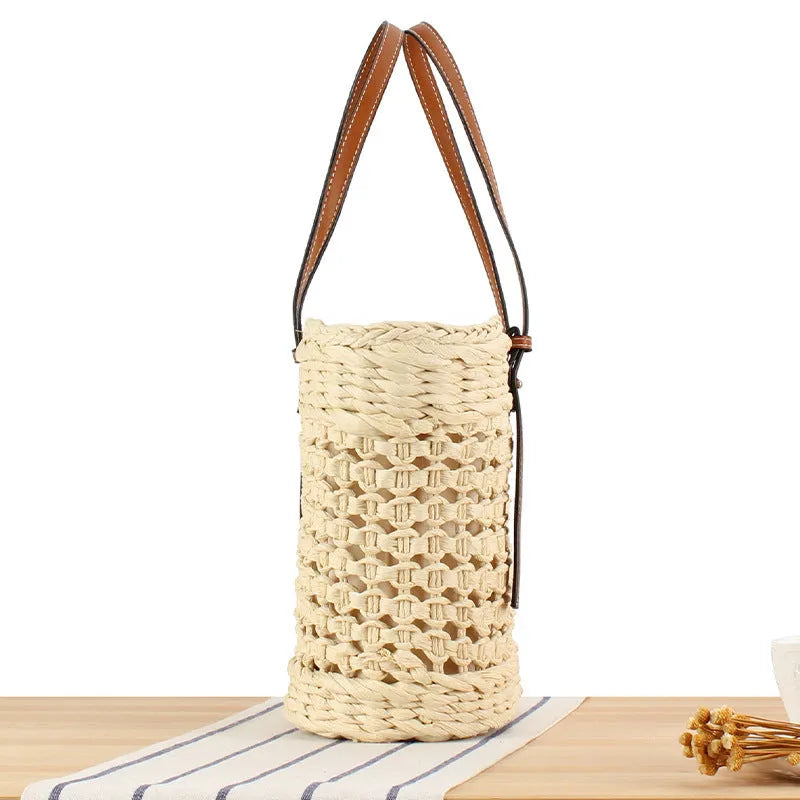 Beige woven paper-string shoulder bag with horizontal square shape and adjustable strap