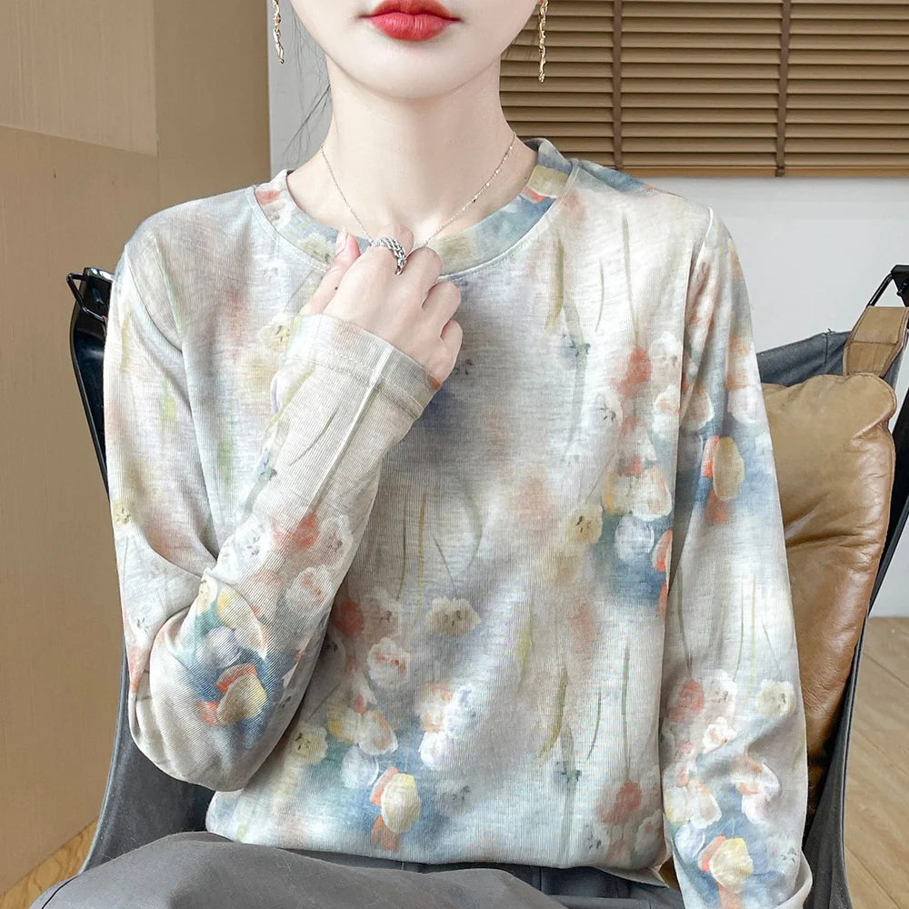 Round neck floral print pullover shirt in Tencel cotton blend fabric on hanger