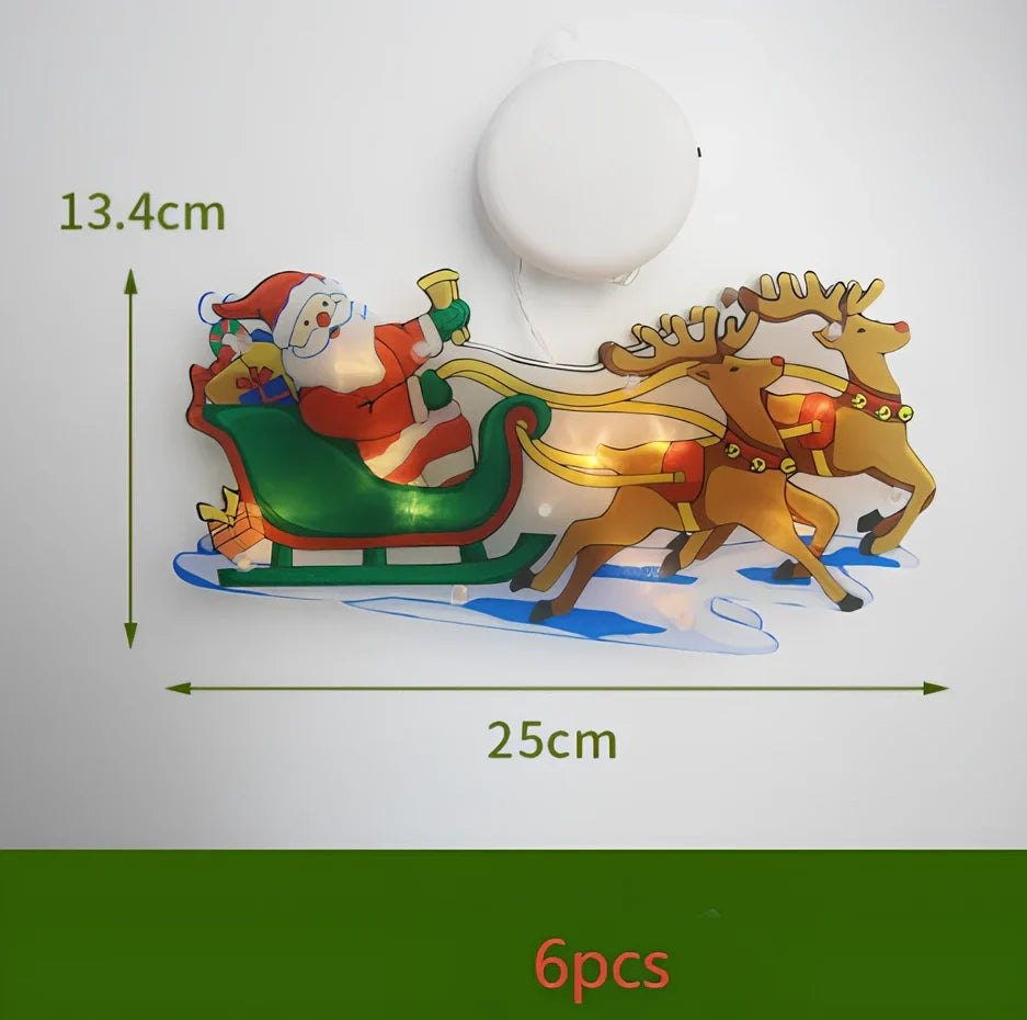 LED Christmas hanging lights with suction cups showing snowman design illuminated on window