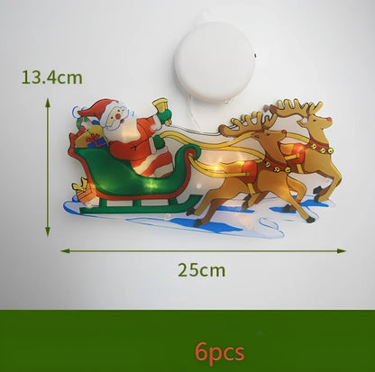 LED Christmas hanging lights with suction cups showing snowman design illuminated on window