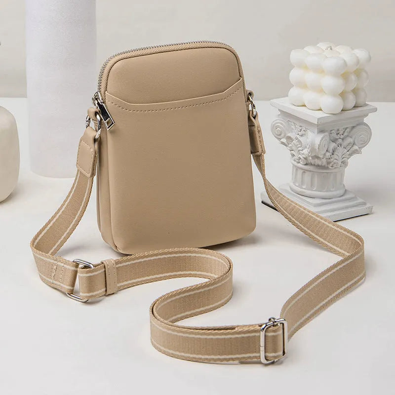 Solid colour mobile phone bag with adjustable strap showing 14.5x5.5x19cm dimensions and PU material construction