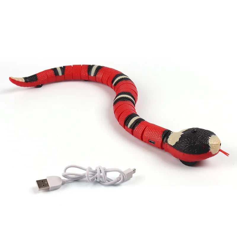 Smart sensing electronic snake cat toy with segmented body for realistic slithering motion on floor.