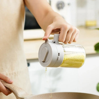 Small glass seasoning jars with lids and spoons in various colors for kitchen organization