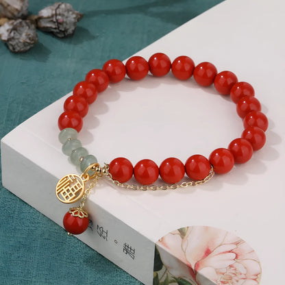 Retro red cinnabar fu character bracelet with jade beads and a long tassel