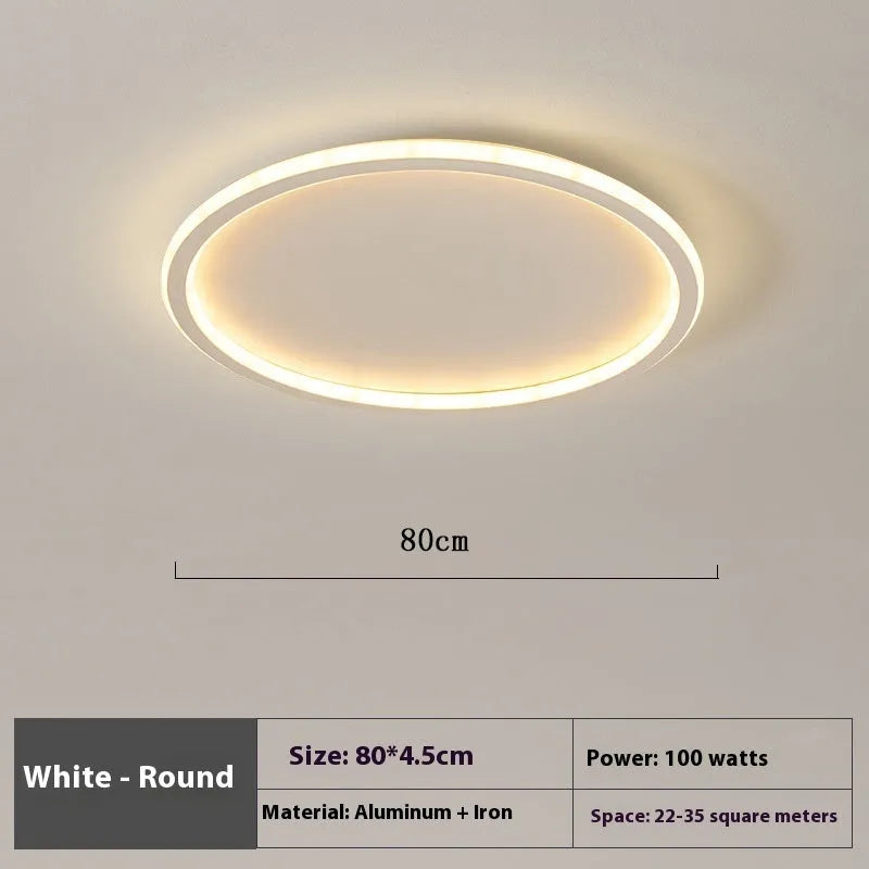 Minimalist circular ceiling lamp in gold finish mounted on a white ceiling