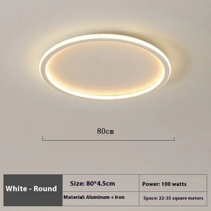 Minimalist circular ceiling lamp in gold finish mounted on a white ceiling