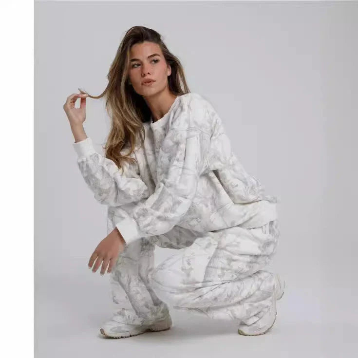Camouflage and maple leaf print two-piece set for women featuring a hoodie and sweatpants in a variety of sizes