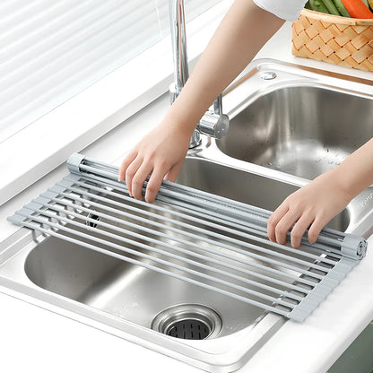 Black folding stainless steel sink drain rack with silicone edges, shown both unfolded for drying and folded for storage