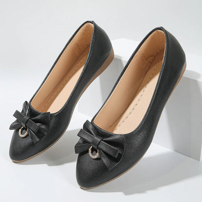 Women's beige flat casual slip-on shoes with bowknot detail and shallow mouth design