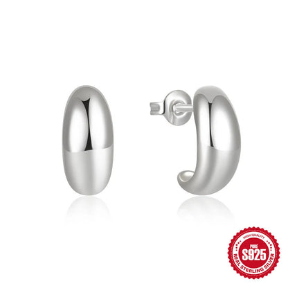 C-shaped sterling silver earrings with glossy electroplated finish in gold or white gold options