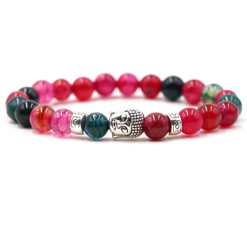 Natural stone stretch bracelet with round beads in various colours including Tigereye and turquoise.