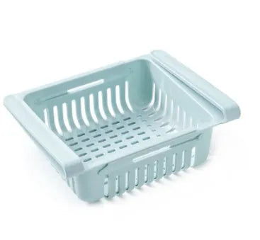 Plastic telescopic refrigerator storage basket in apricot colour, showing multiple compartments for organisation.