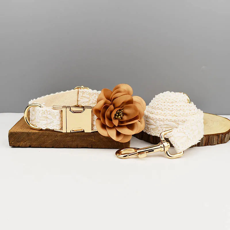 White lace dog vest and matching collar with floral decoration for wedding or special occasion.