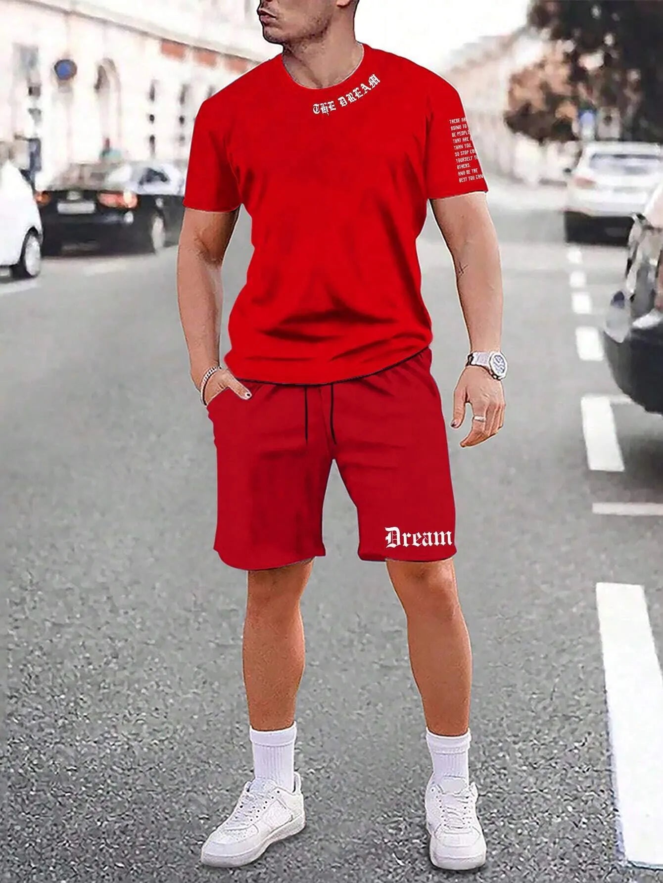 Man wearing a grey short-sleeve sports top and matching shorts from the quick-dry polyester set.