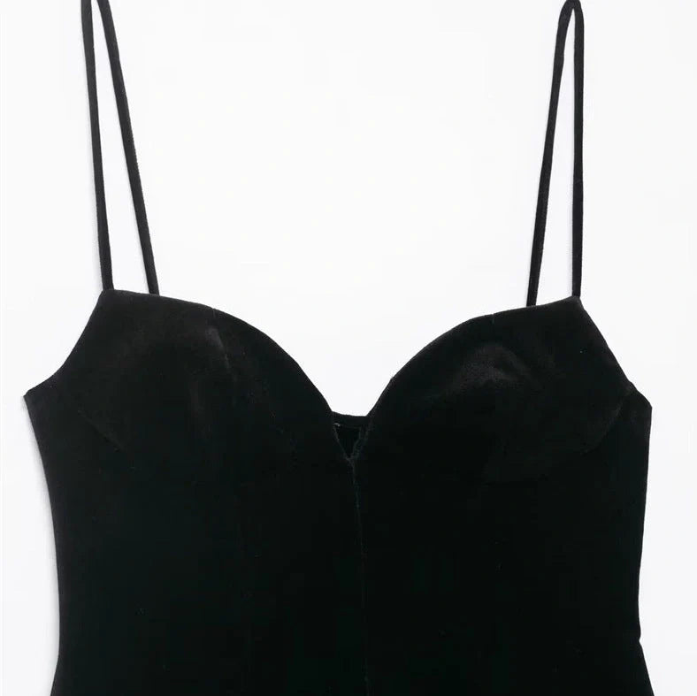 Black women's hooded dress with flared irregular hem, thin straps, and shirring detail on mercerised cotton knitted fabric