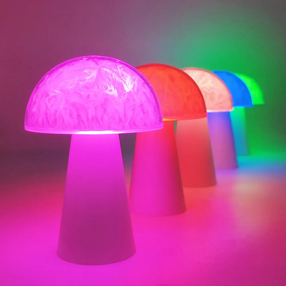 Mushroom-shaped RGB colour-changing night light with remote control on a wooden surface