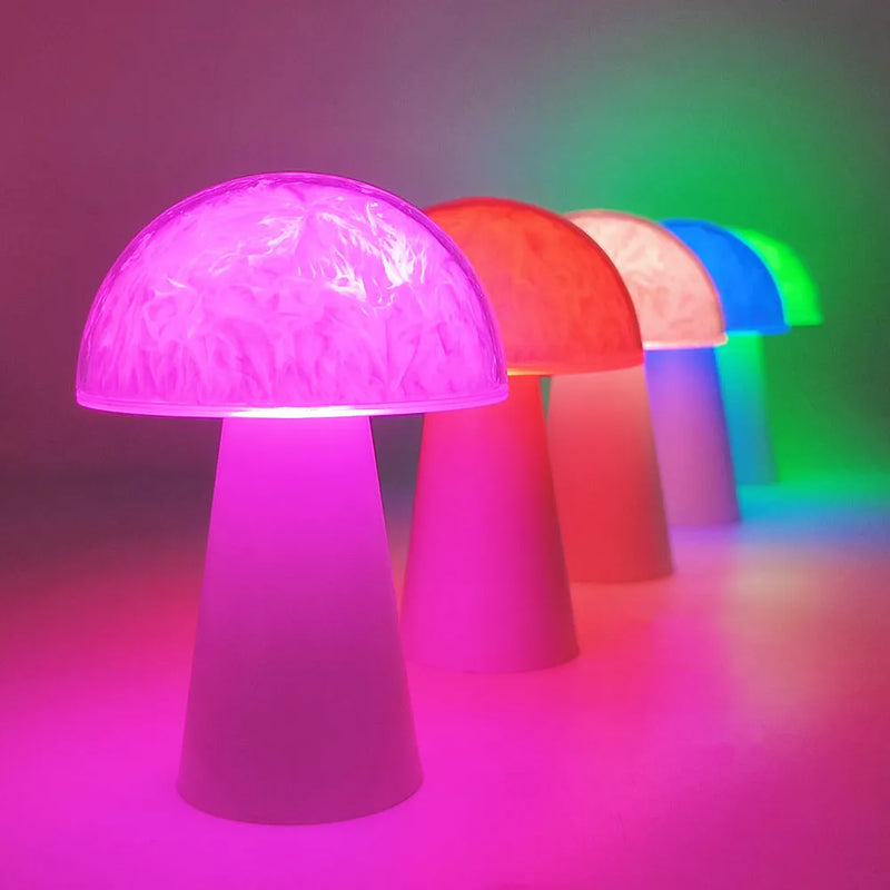 Mushroom-shaped decorative night light with RGB colour changing, remote control operation, and battery-powered portability measuring 9cm by 9cm by 13.5cm for bedside tables, desks, and gift-giving occasions