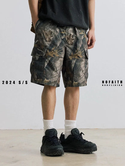 Loose straight-leg denim shorts for teenagers in army green, showing elastic waistband and zip fly.