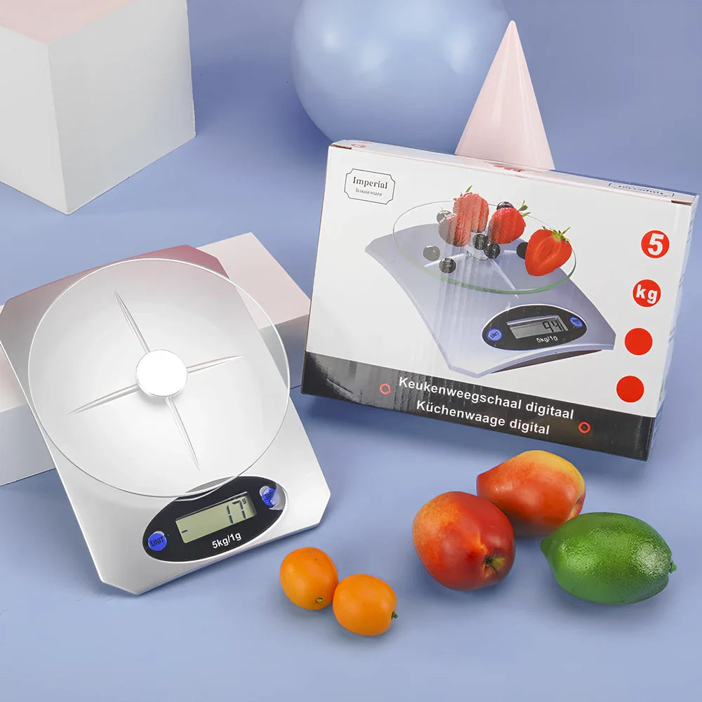 Silver white mini electronic kitchen scale with digital display showing 0.1g precision measurements