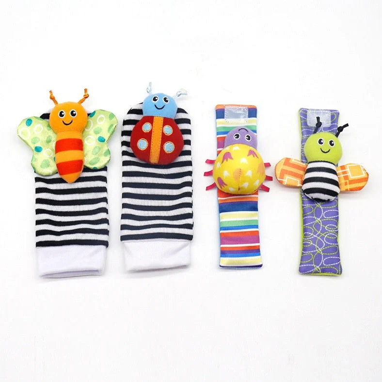Four fabric baby socks with cartoon designs and ringing feature for infant training