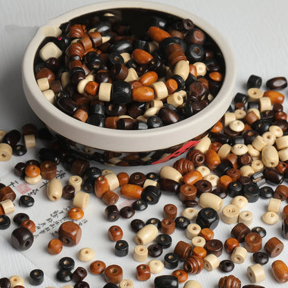 Mixed vintage solid wood beads scattered for DIY jewellery making and craft projects