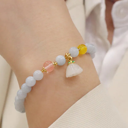 Gold plated women's bracelet with artificial crystal aquamarine chalcedony pendant in climbing cat design
