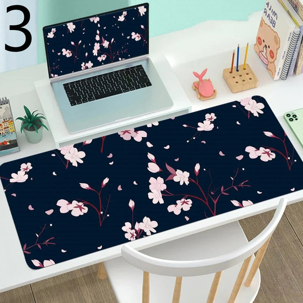 Large gaming mouse desk mat showing printed design on rubber surface with size options up to 400x900mm