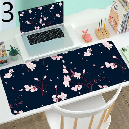Large gaming mouse desk mat showing printed design on rubber surface with size options up to 400x900mm