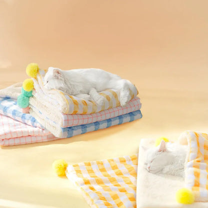Blue coral fleece pet blanket shown in a Large size (70x50cm) on a wooden floor.