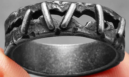 Stainless steel double ring with dark punk stitching pattern showing layered band design