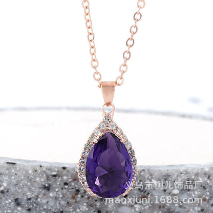 Rose gold geometric water drop pendant necklace on a model, showing adjustable chain and sparkling stone inlay.