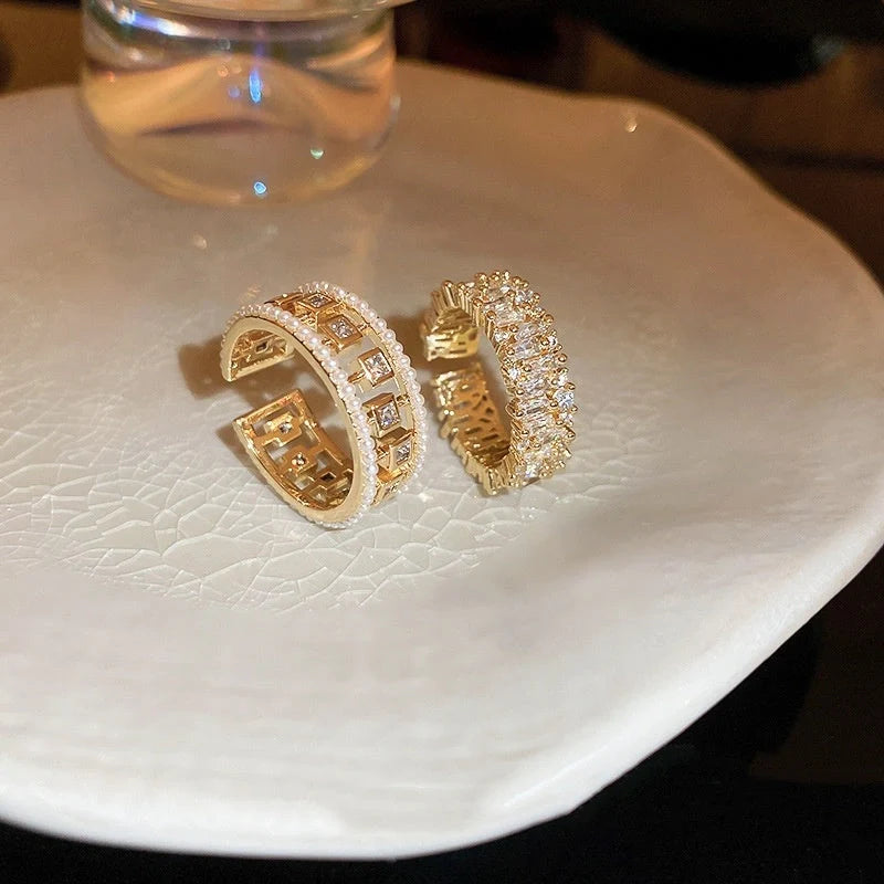 Elegant pearl hollowed-out square open-end zircon ring for women, fashion jewelry with geometric design.