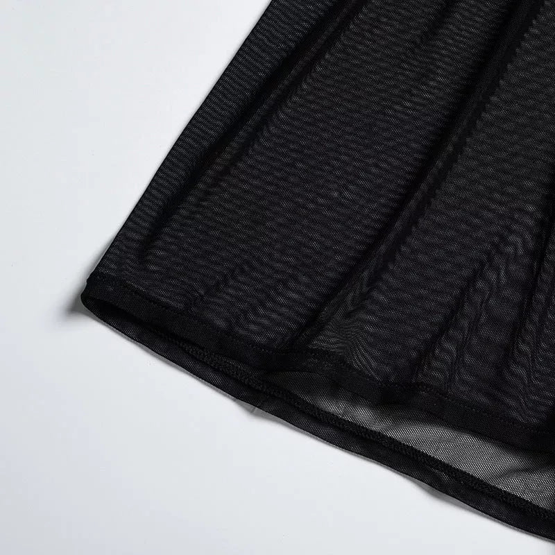 Solid black sling bikini set for women, includes bra, jacket, skirt, and shorts