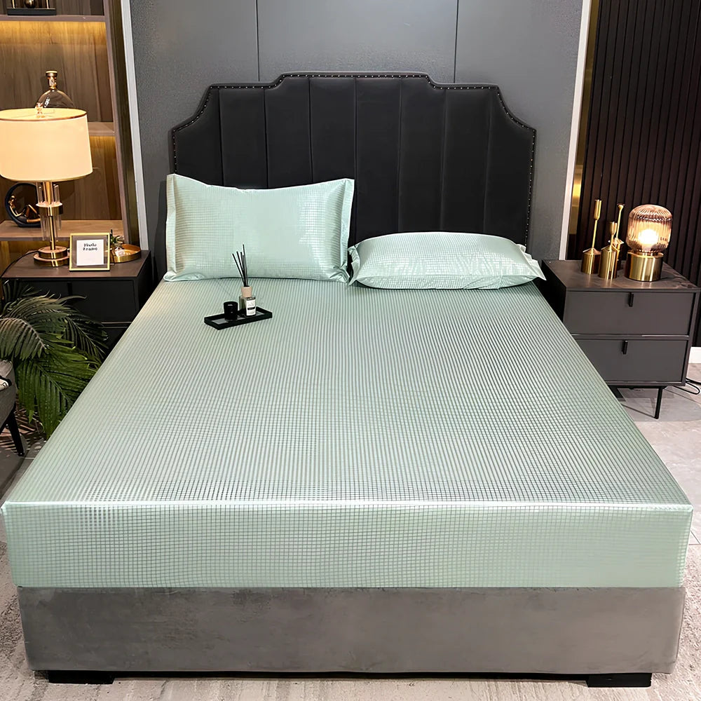 Houndstooth ice silk jacquard fitted three-piece bedding set in ice blue, 180x200cm size with pillowcases on white bed