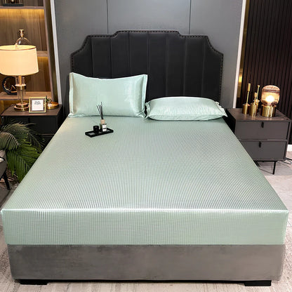 Houndstooth ice silk jacquard fitted three-piece bedding set in ice blue, 180x200cm size with pillowcases on white bed