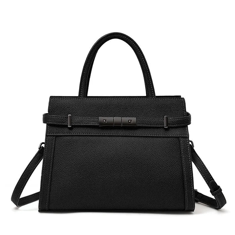 Women's square genuine leather crossbody handbag in clamshell style with internal compartments.