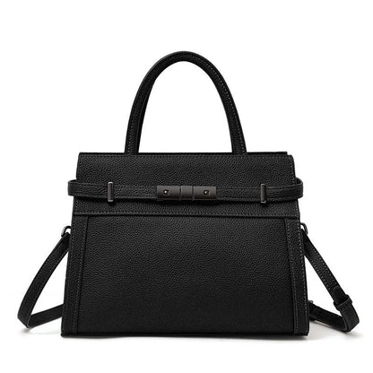 Women's square genuine leather crossbody handbag in clamshell style with internal compartments.