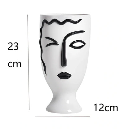 Ceramic vase with hand-painted surface in modern minimalist design, shown in large and small size variations
