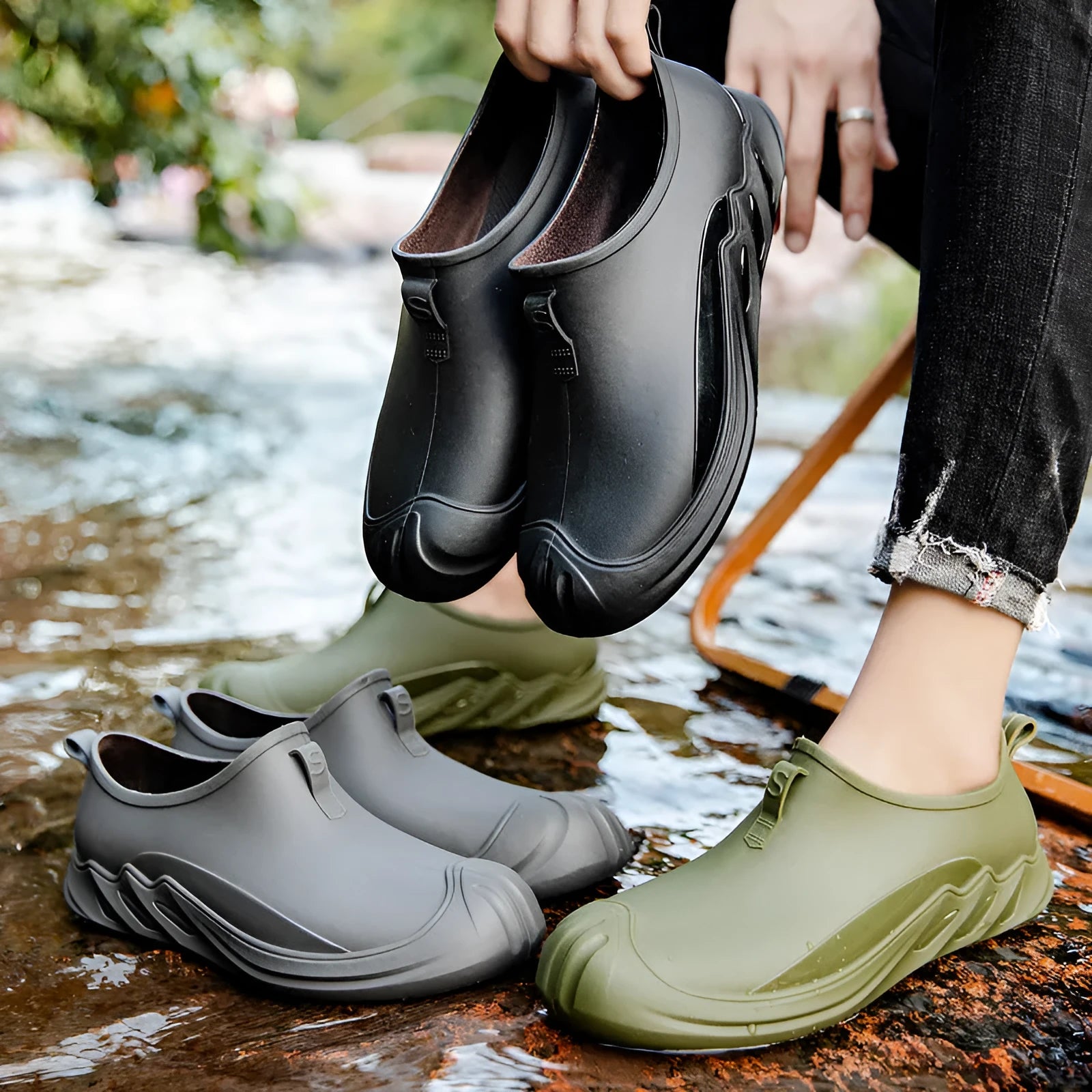 Men's short black plastic rain boots showing casual design and waterproof construction