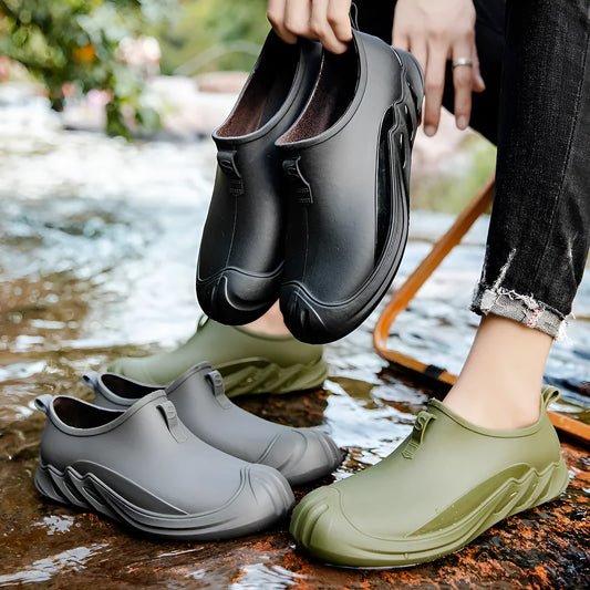 Men's short black plastic rain boots showing casual design and waterproof construction